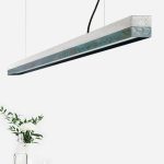 Langbordspendel i beton og oxideret kobber